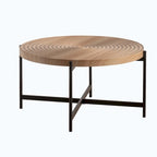 Table basse ronde au design moderne avec piètement en métal croisé