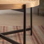 Table basse ronde au design moderne avec piètement en métal croisé